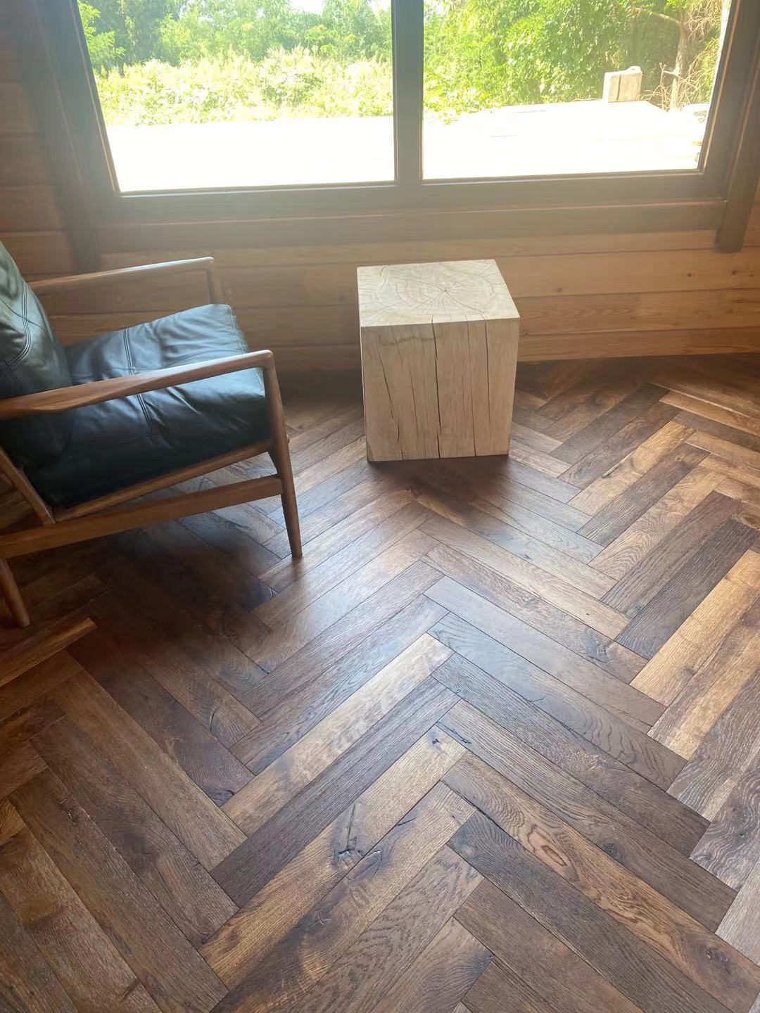 Engineered oak herringbone flooring installed in a classic heritage townhouse in London, featuring dark-tone brushed smoked UV lacquer finish and traditional parquet pattern