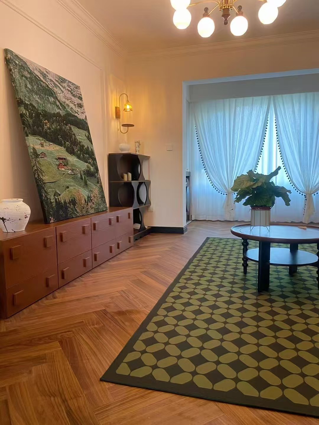 Warm walnut herringbone engineered wood flooring installed in a mid-century modern Amsterdam apartment, featuring elegant oak grain, smooth UV lacquer finish, and retro-inspired interior styling with natural daylight.