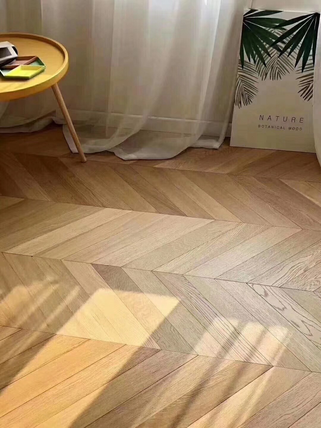 Engineered oak chevron flooring installed in a Japandi-style loft in Kyoto, Japan, featuring warm natural oak tone with brushed UV lacquer finish