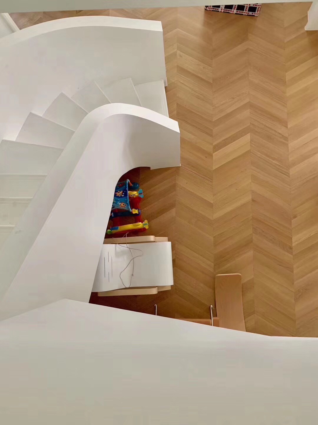 Engineered oak chevron flooring installed in a Japandi-style loft in Kyoto, Japan, featuring warm natural oak tone with brushed UV lacquer finish