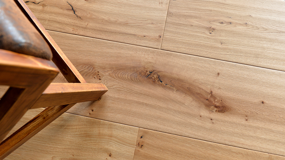 AM-06 hand-scraped surface texture close-up showing cabinet-scraper wave pattern