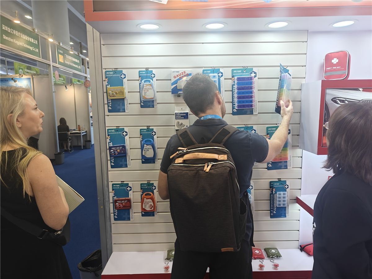 International buyers reviewing first aid products at the ORI-POWER booth