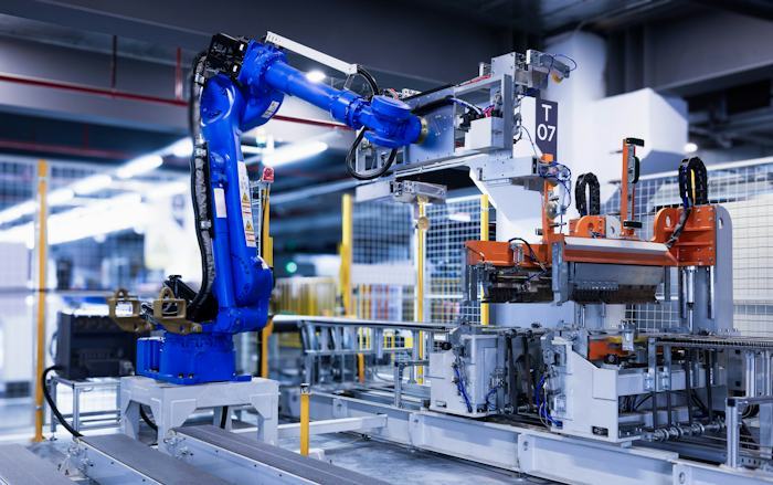 Industrial robotic arm operating in a factory
