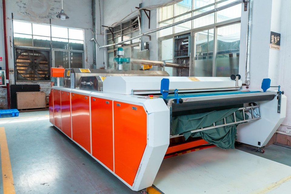 Eationwear pre-shrinkage and finishing machine (shrink-setting stenter) processing fabric in the finishing room