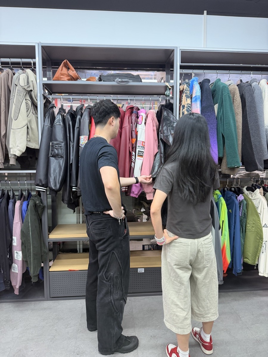 Canadian client reviewing garments in the INFULLSAIL showroom