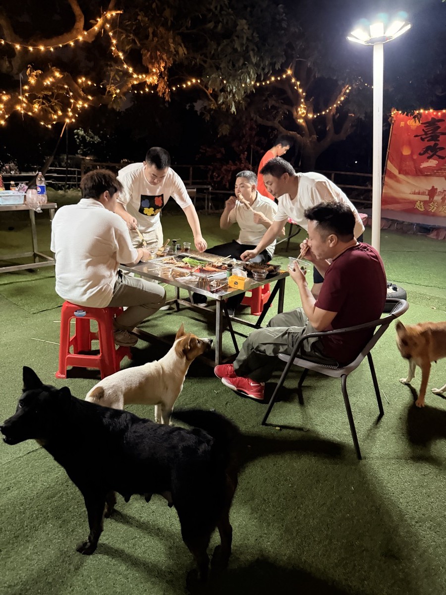 INFULLSAIL team sharing food at the team building barbecue