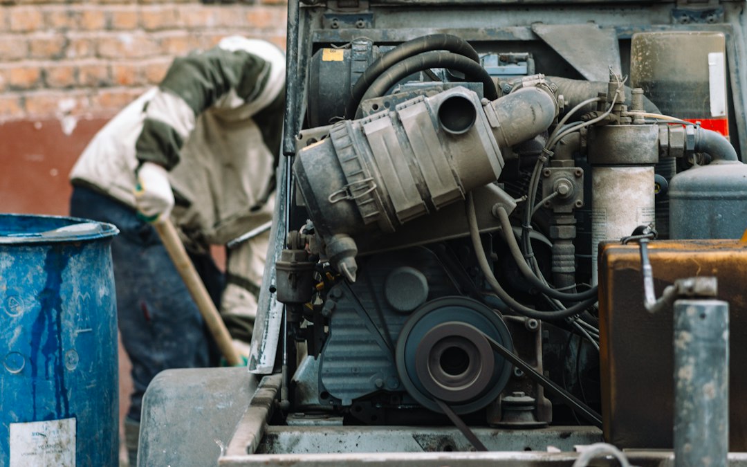 A technician performing maintenance on an air compressor