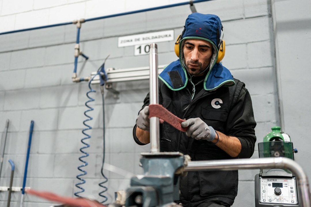 A technician inspecting an air-oil separator filter