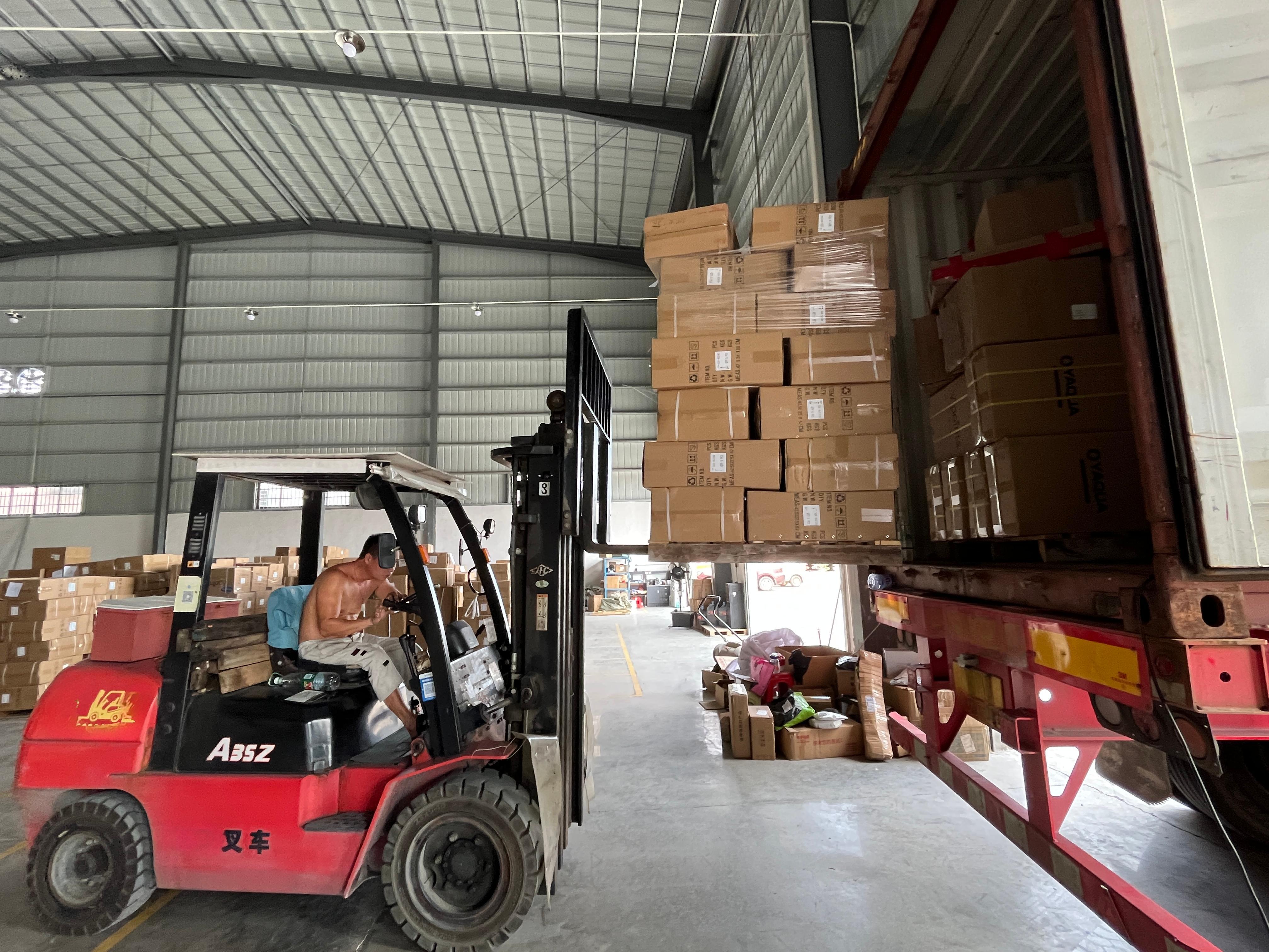 Loading the Guinea shipment at the warehouse