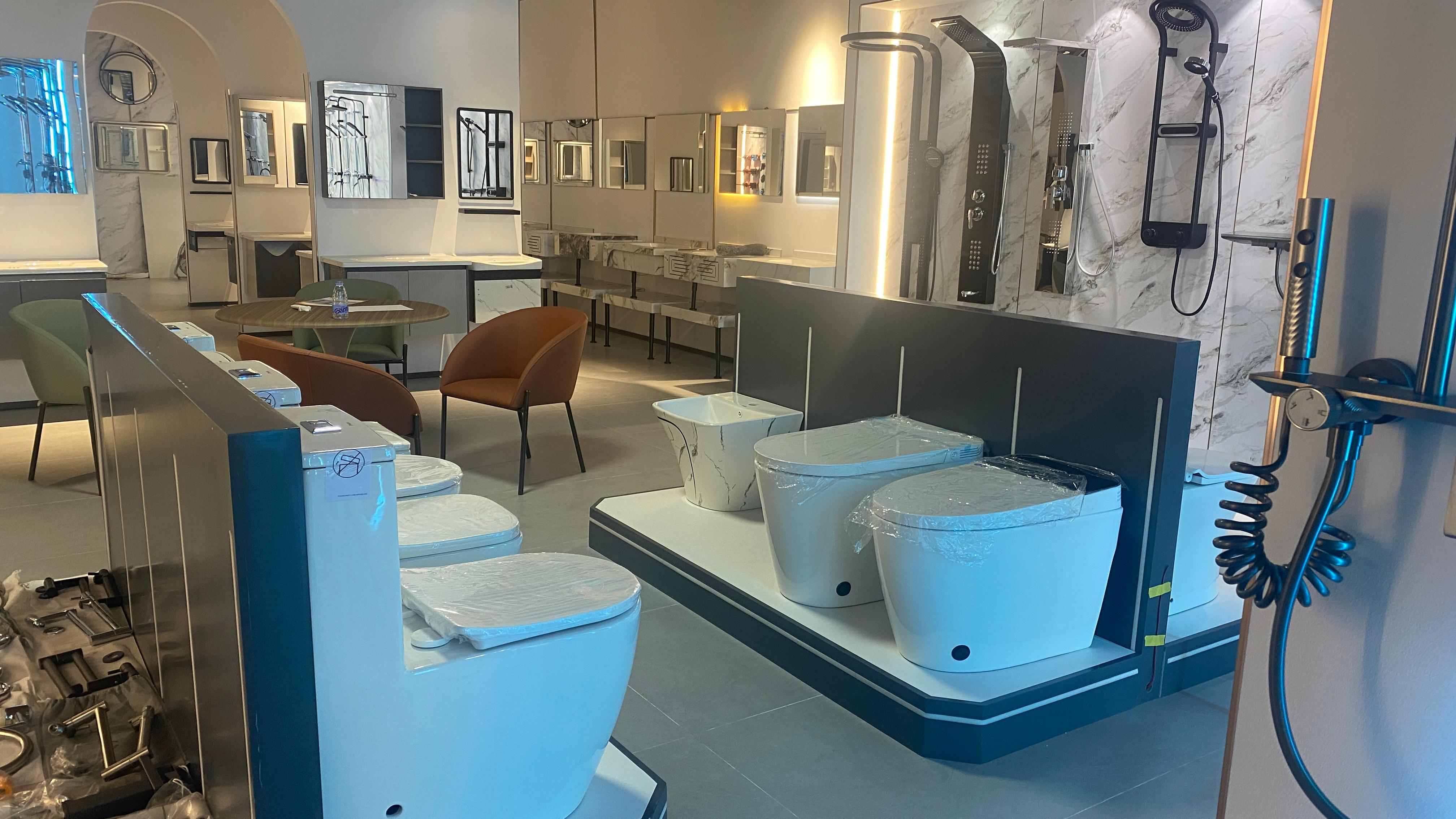 Showroom display of OYAQUA bathroom products