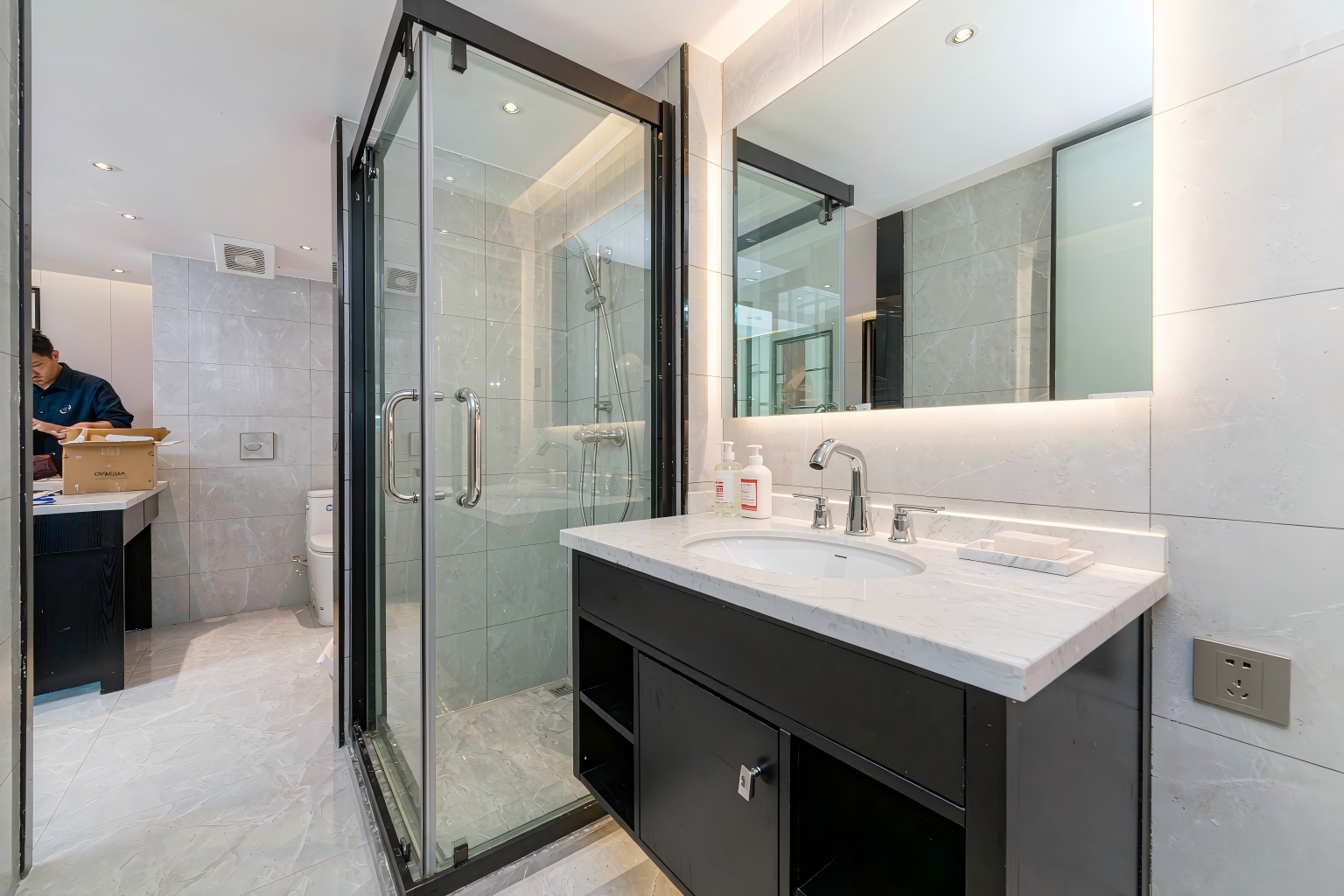 Newly fitted bathroom in a building project with OYAQUA products being unpacked on site