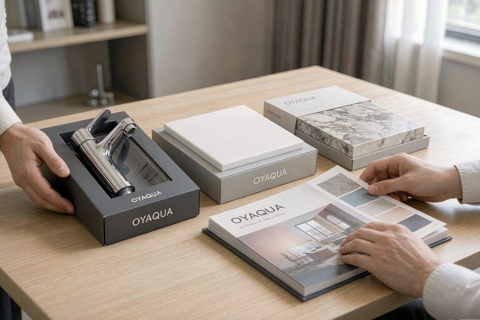 Oyaqua sample kit with faucet, ceramic swatches and product catalogue on a desk