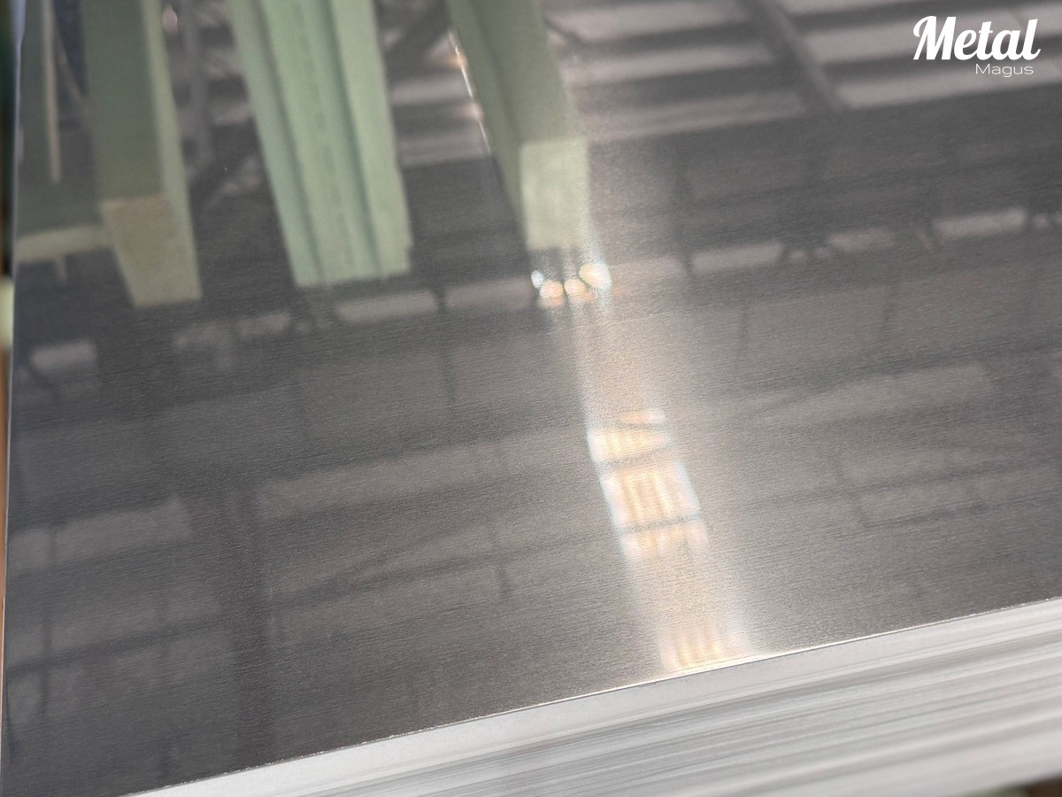 2B stainless steel sheets in stack — smooth semi-reflective surface
