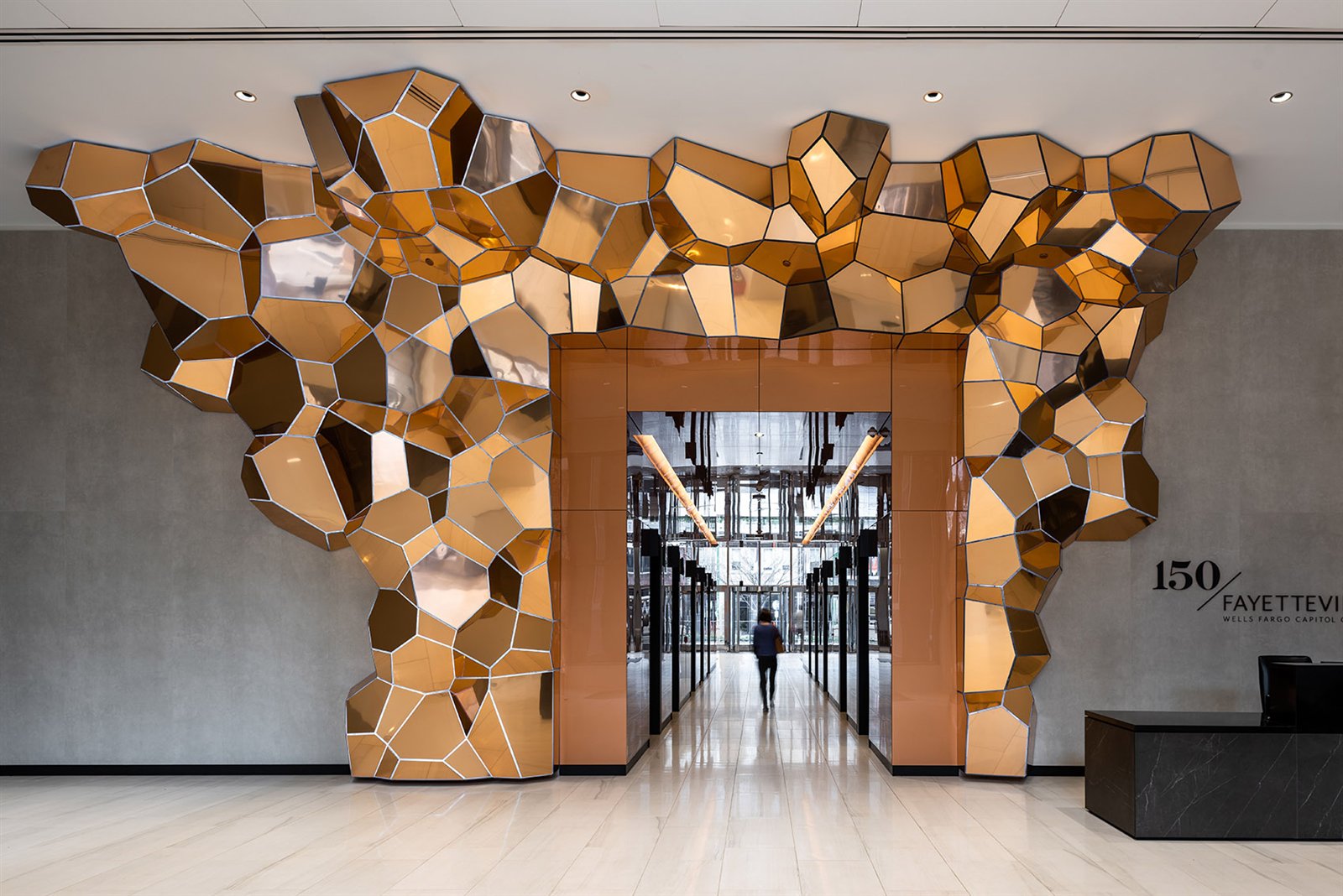 Sculptural bespoke metal feature formed from faceted stainless steel
