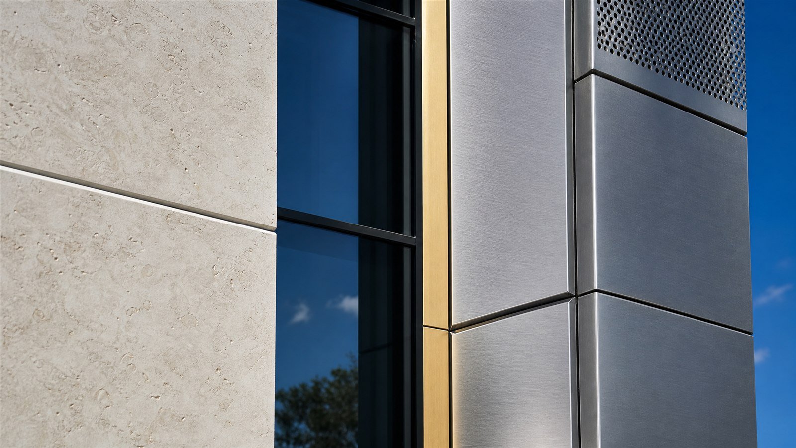 Close view of the metal panel facade junction showing folded edges and continuous joint lines
