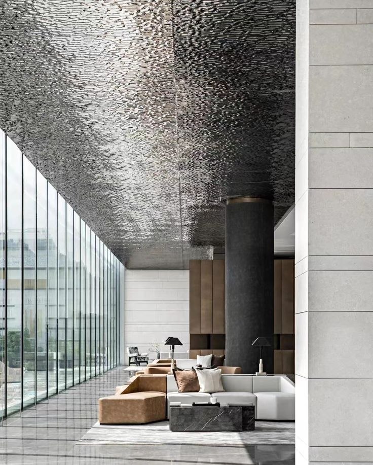 Formed stainless steel ceiling above a hotel lounge seating area