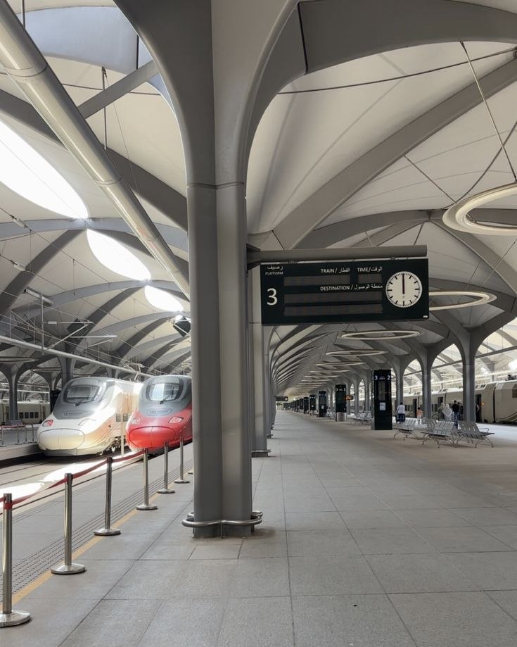 Ribbed metal canopy ceiling above a railway station platform