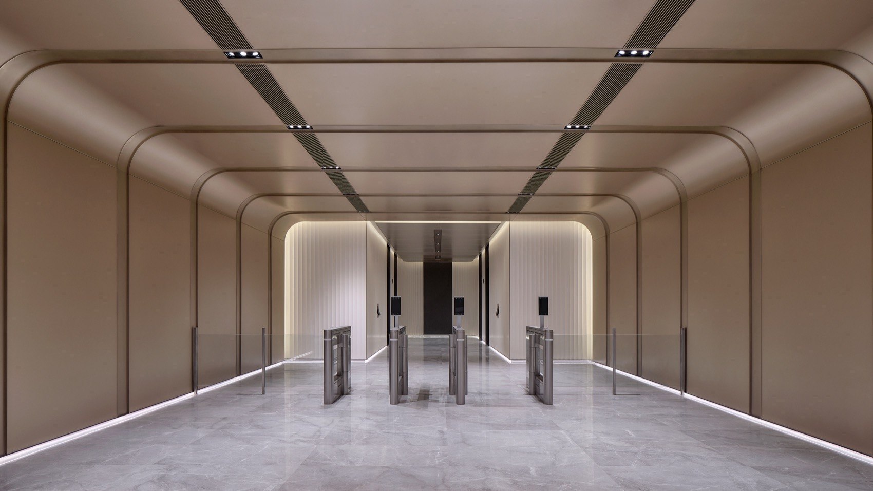 Champagne metal ceiling and wall linings in a corporate headquarters lobby