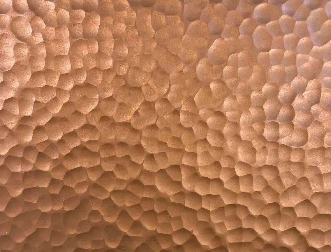 Rose gold PVD tone on the same hammered embossed stainless steel texture