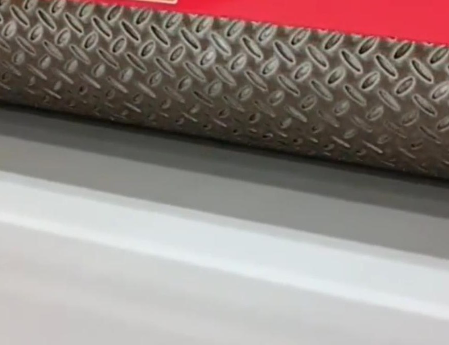 Textured embossing roller forming a stainless steel sheet on the production line