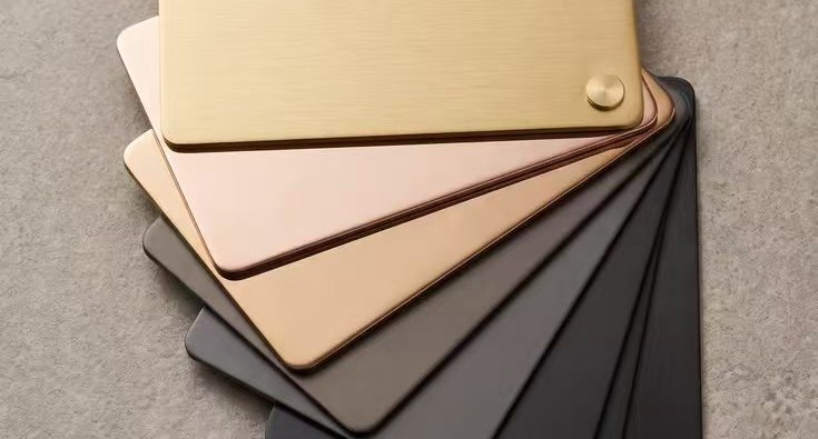 PVD colour coated stainless steel samples fanned across a range of metallic tones