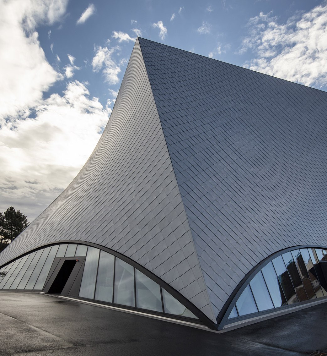 Folded stainless steel roof geometry on an art gallery