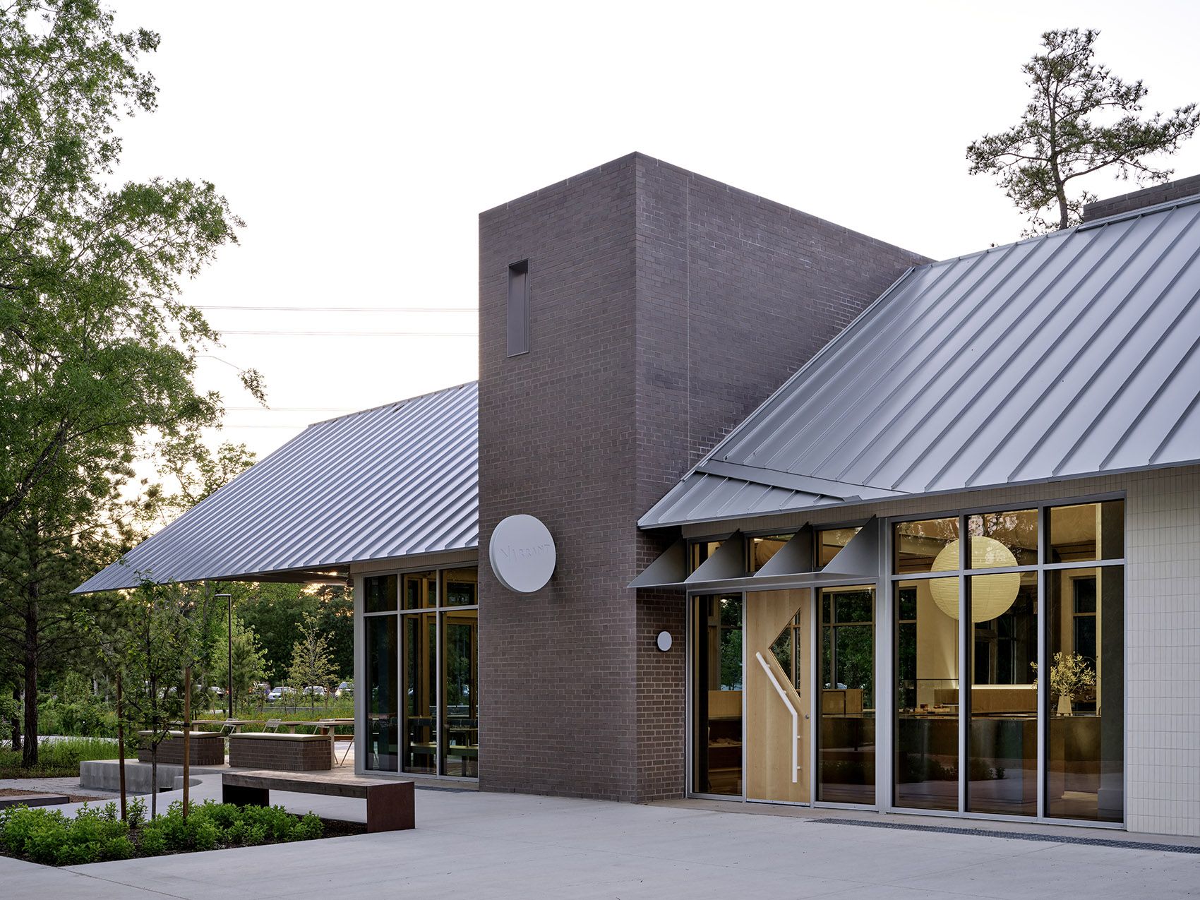 Brushed stainless steel standing seam roof with a controlled directional grain