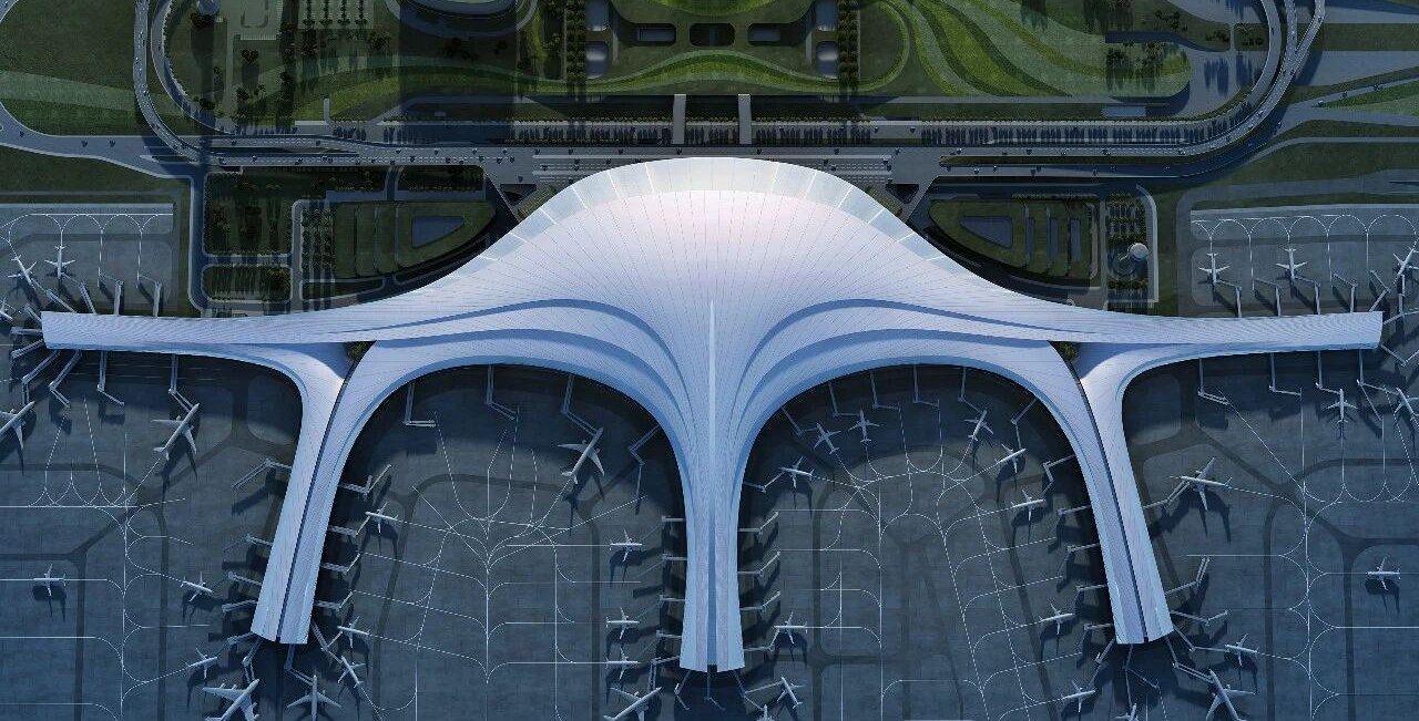 Continuous stainless steel roof over an airport terminal concourse
