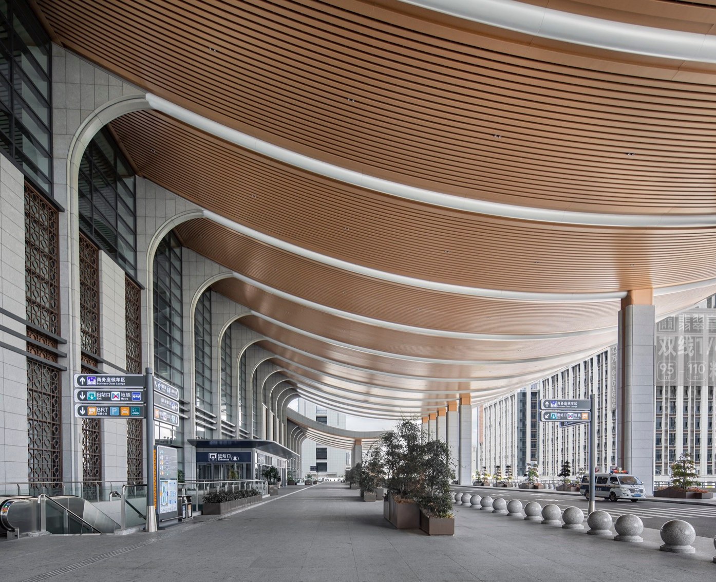 Entrance canopy soffit meeting the portal cladding and column line