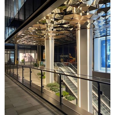Curved Mirror Canopy and Column Cladding