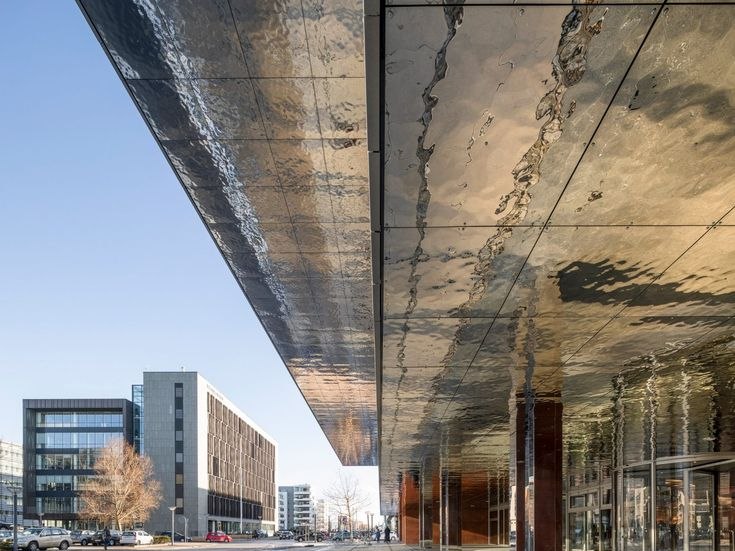Water ripple embossed stainless steel canopy soffit seen from below