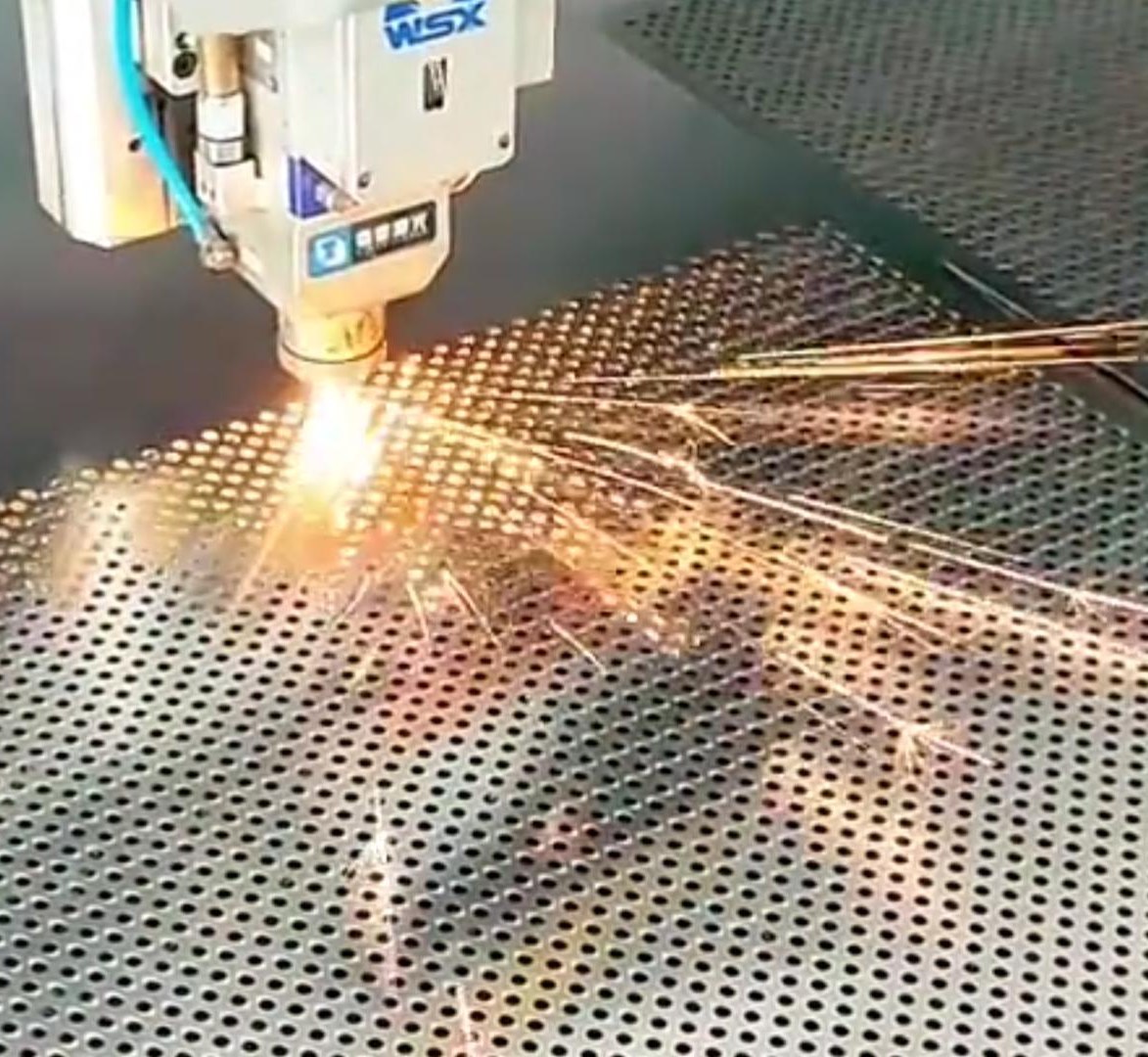 Stainless steel sheet being cut to panel size for wall cladding