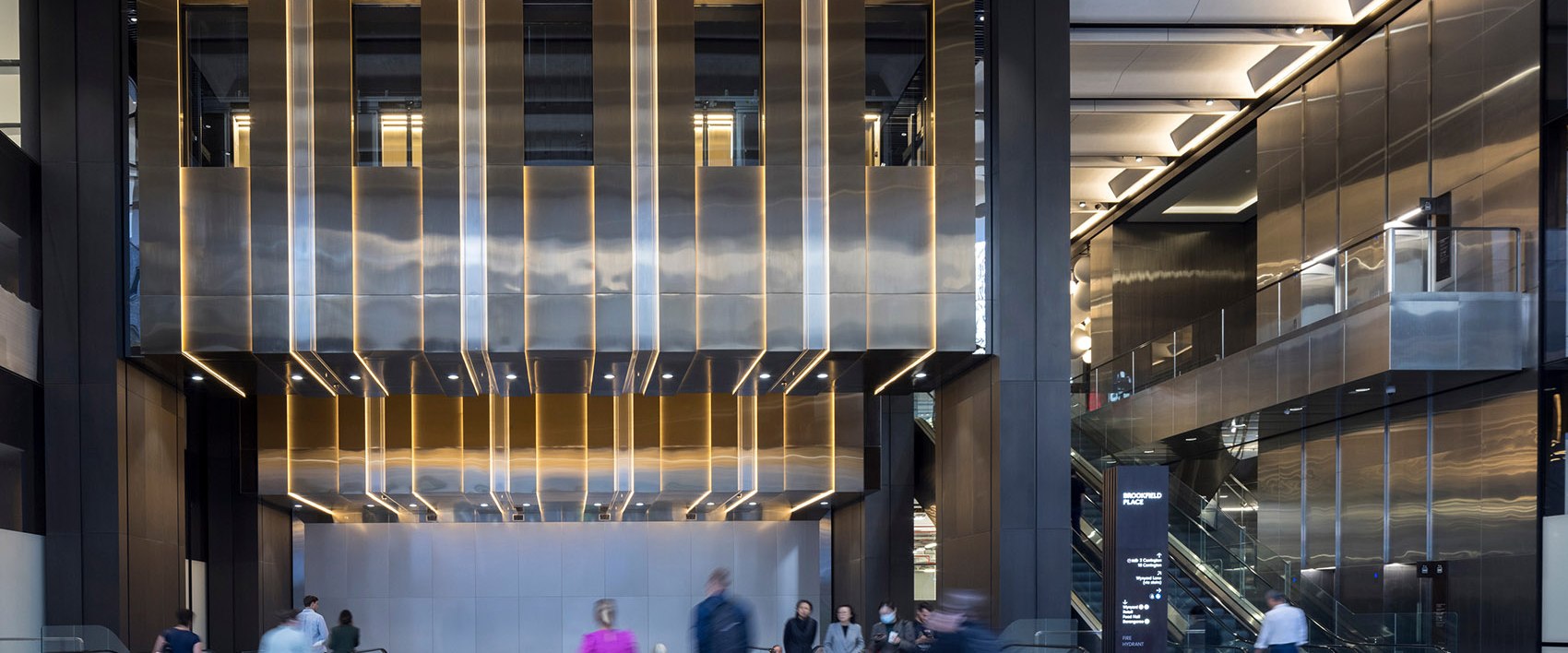Stainless steel wall surfaces defining an interior lobby