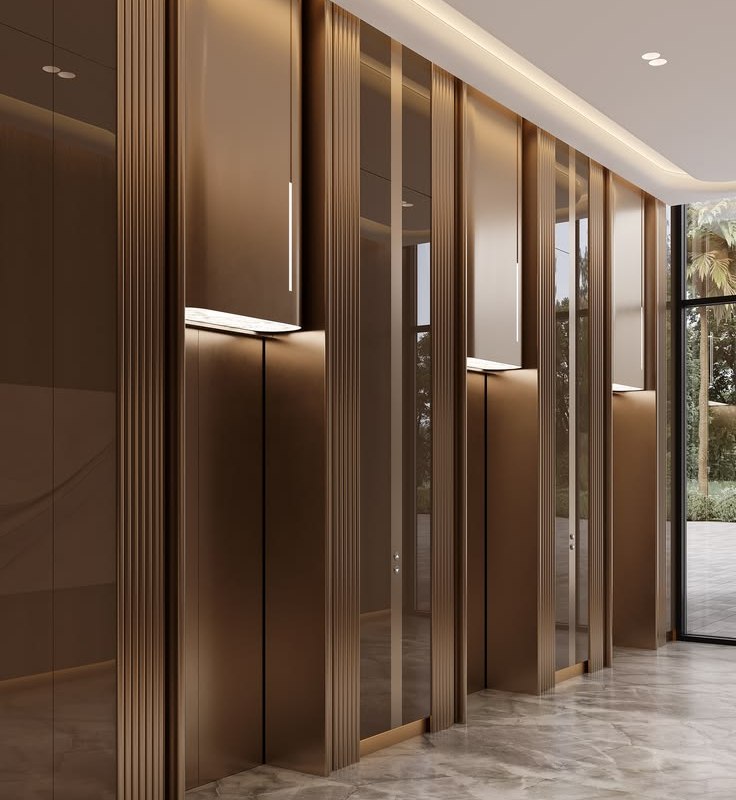 Stainless steel wall panels with a regular joint rhythm along a corridor
