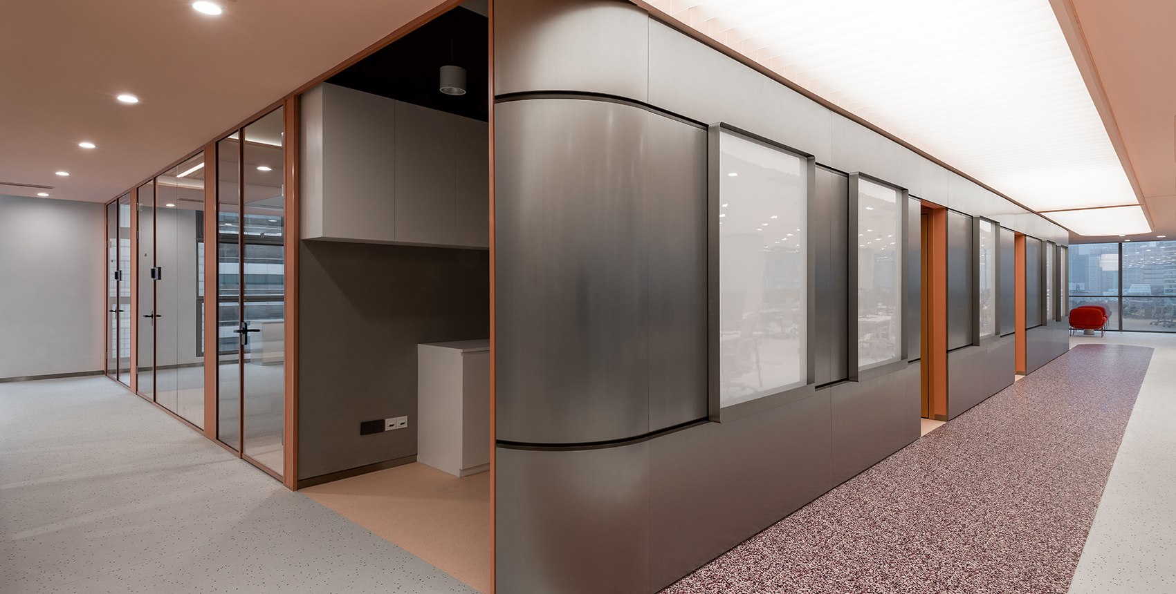 Stainless steel wall system showing panel face, joints, corners and an opening