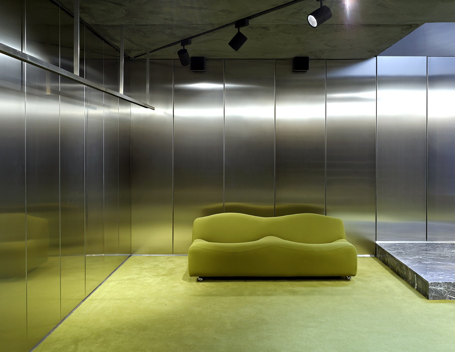 Mirror stainless steel walls in a luxury retail flagship interior