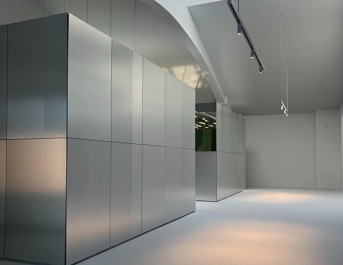 Brushed stainless steel wall panels in a corporate headquarters lobby