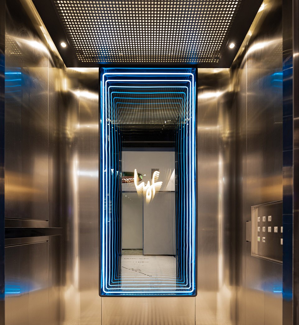 Lobby and portal surfaces continuing the same stainless steel language