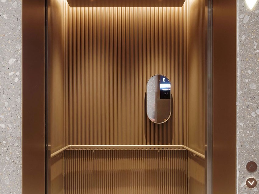 Stainless steel cabin interior with wall and ceiling surfaces in view