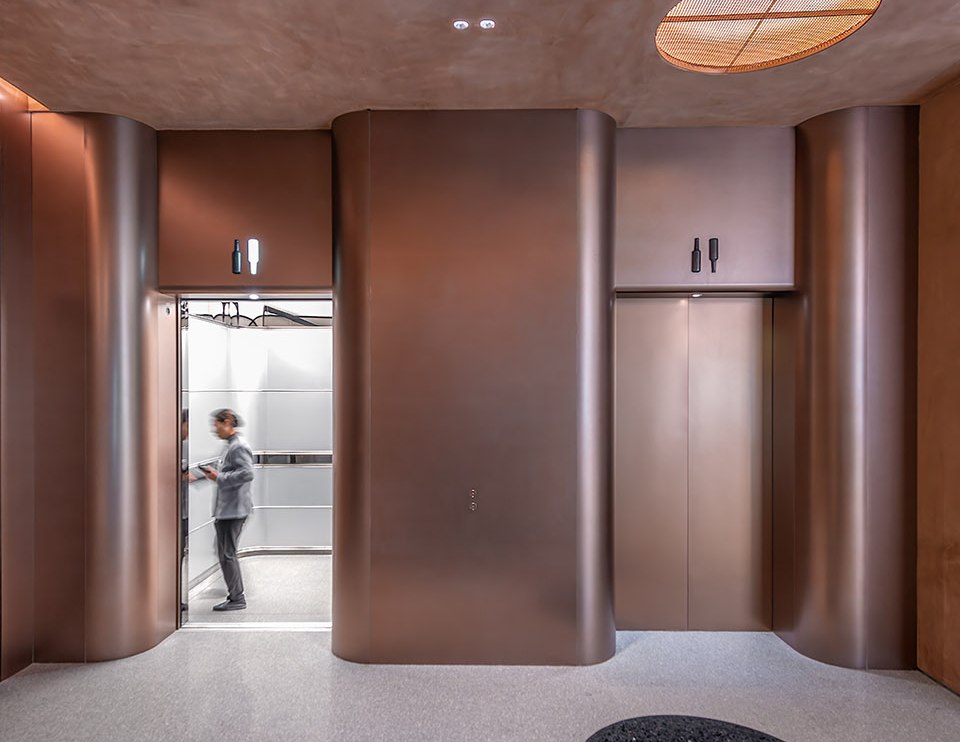 Bronze stainless steel elevator lobby in a hospitality setting