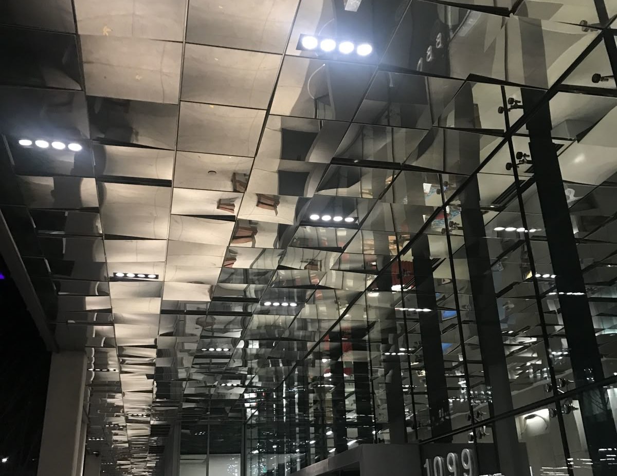 Stainless steel and glass circulation space in a transit building
