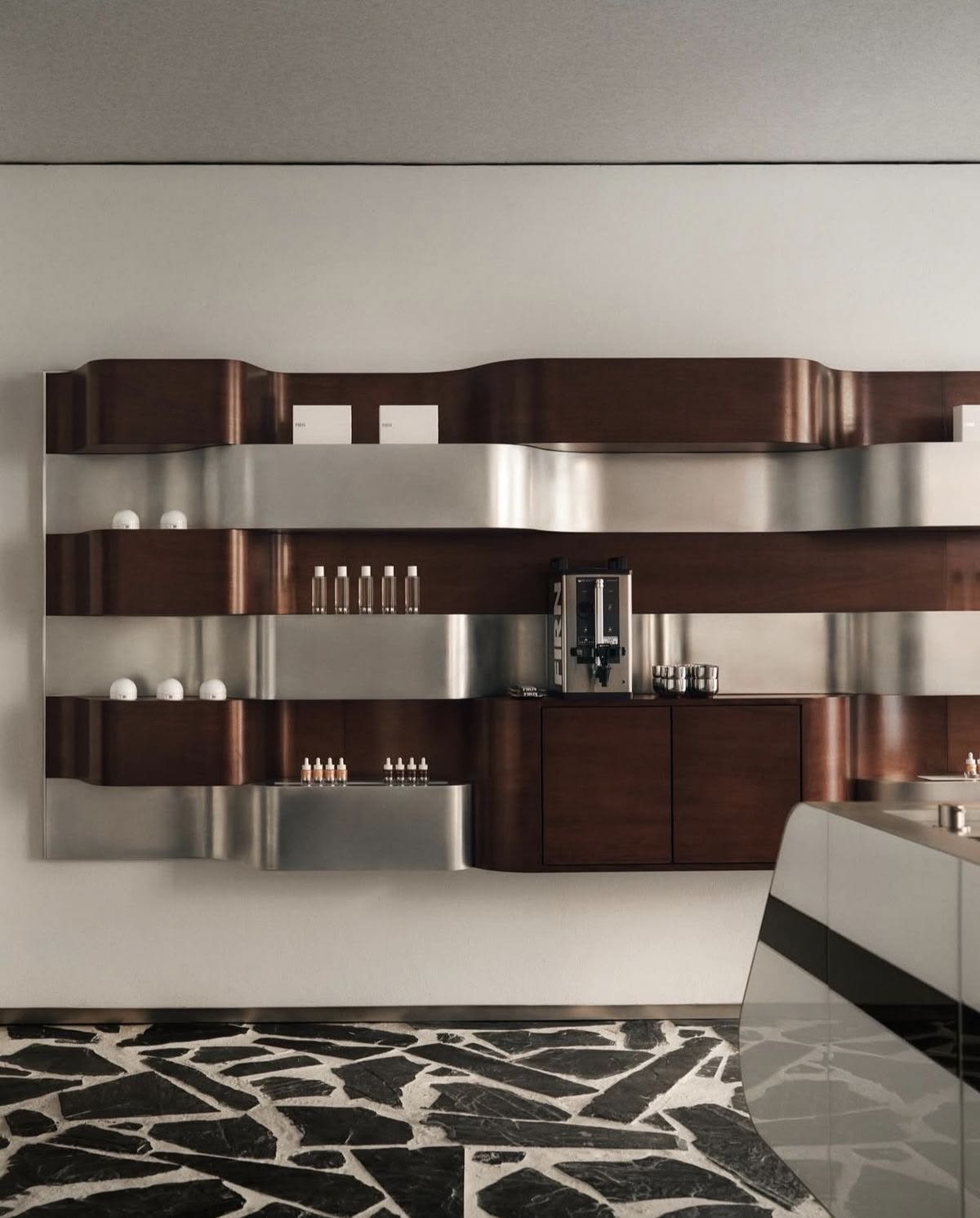 Architectural metal cabinetry and shelving integrated with a wider interior palette