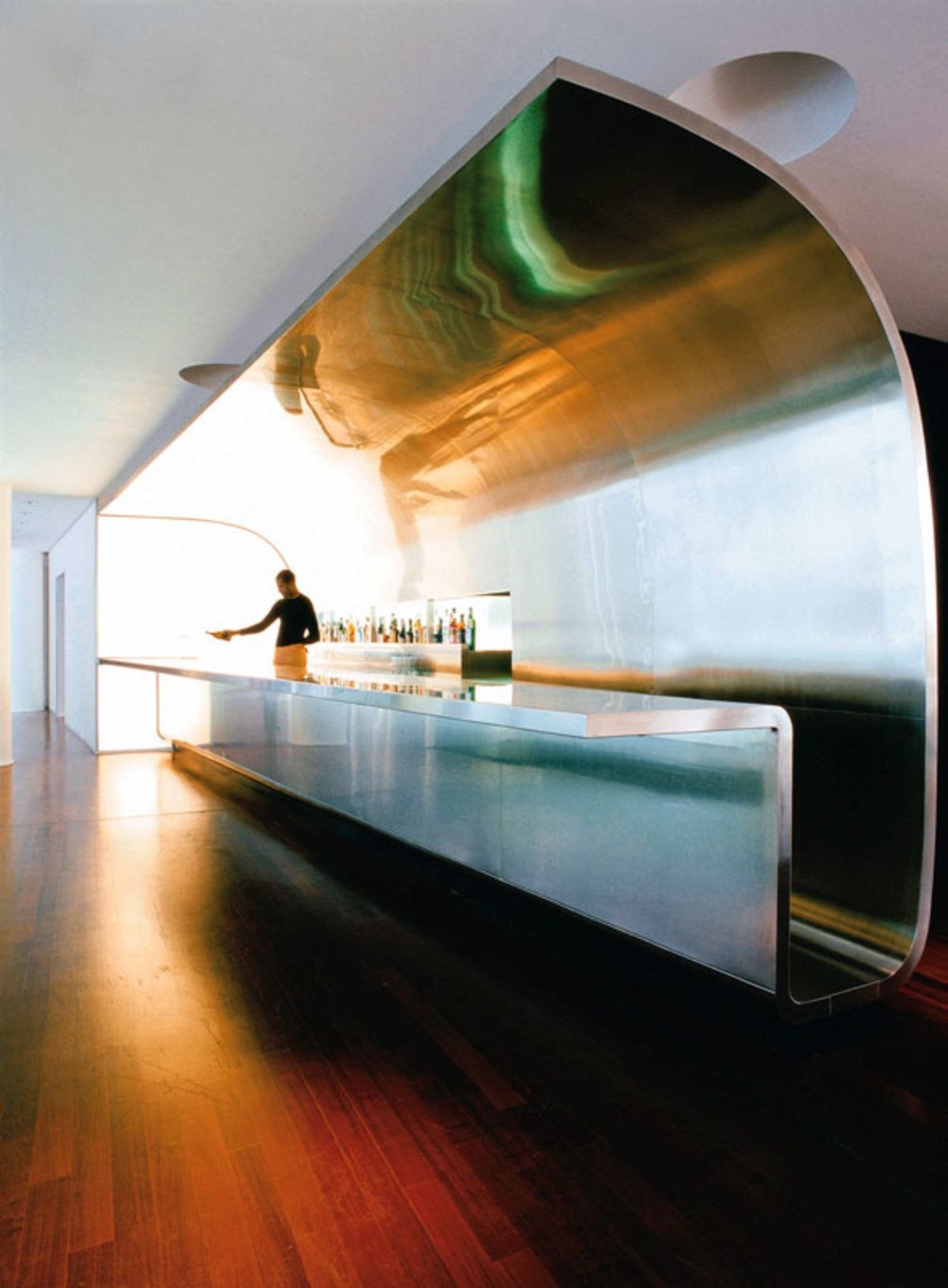 Layered stainless steel feature wall developed as the focal element of an interior