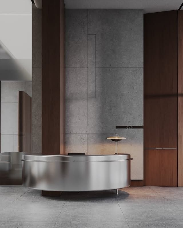 Bronze stainless steel counter meeting a stone wall surface