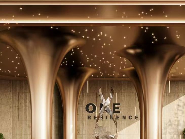 Sculptural stainless steel arches shaped by integrated lighting