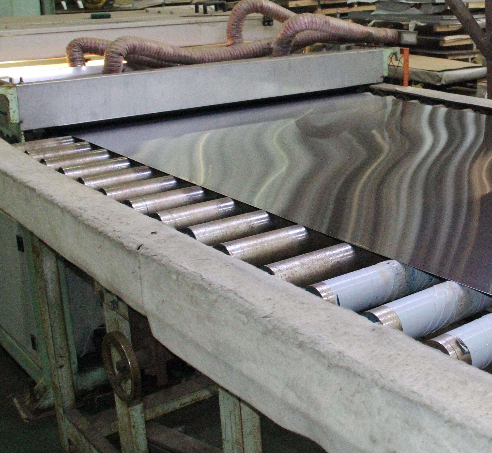 Surface finishing and grinding of stainless steel sheets before fabrication