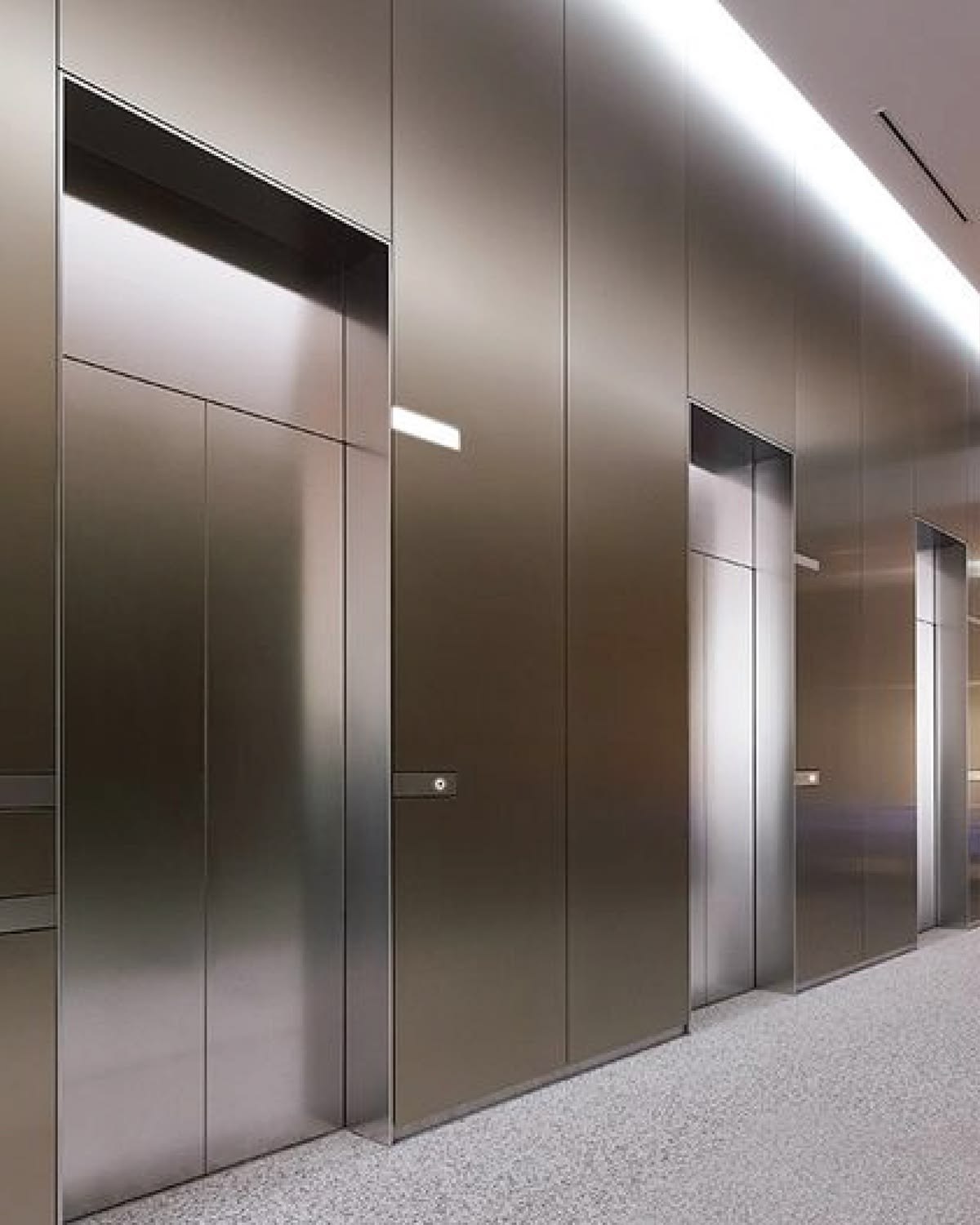 Lift lobby in soft satin stainless steel where diffused surfaces reduce visual glare