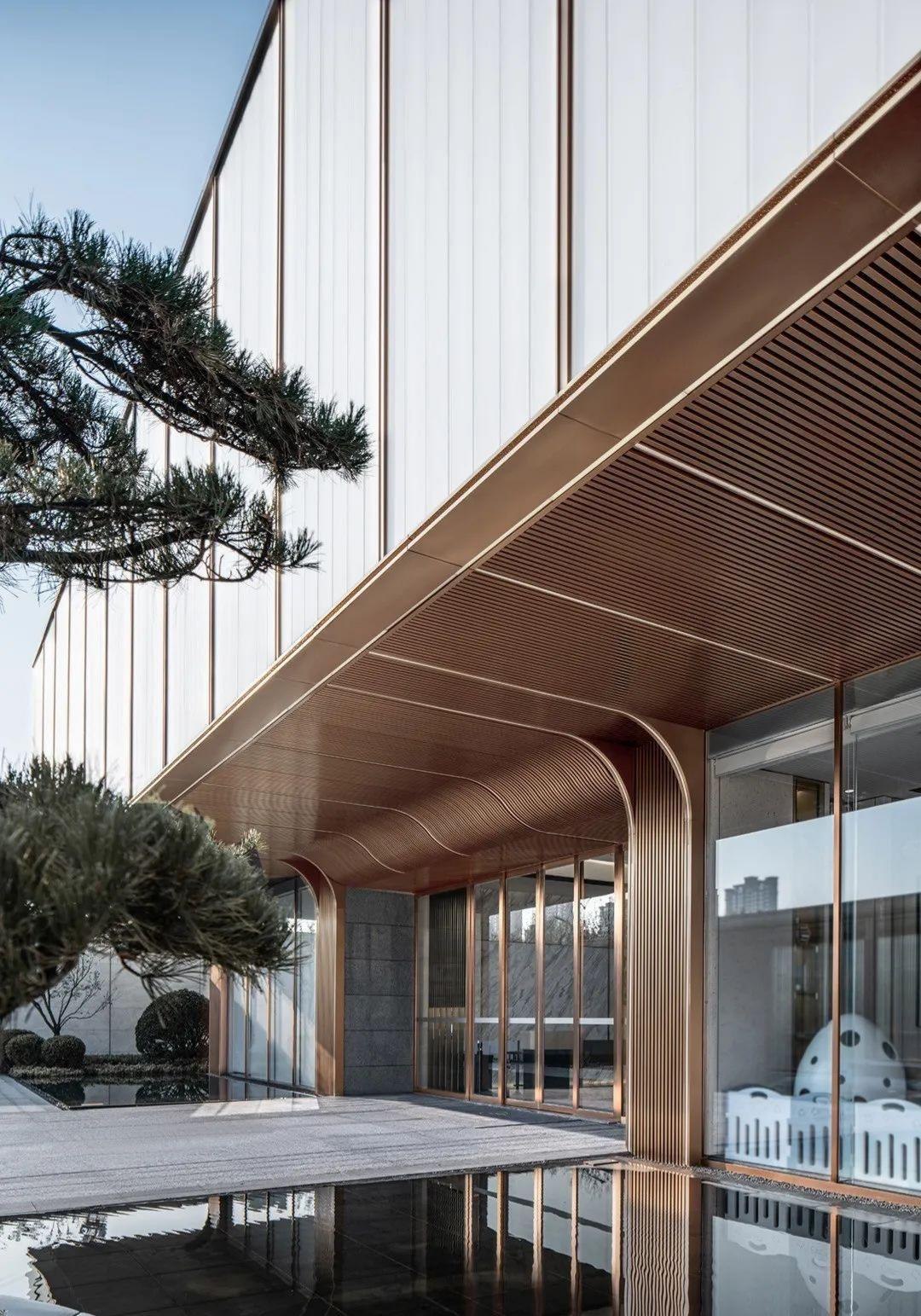 Stainless steel entrance canopy with precise architectural framing