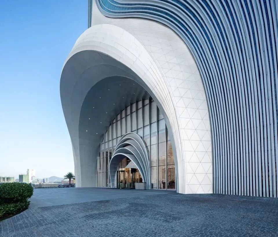 Large architectural stainless steel surfaces under changing light