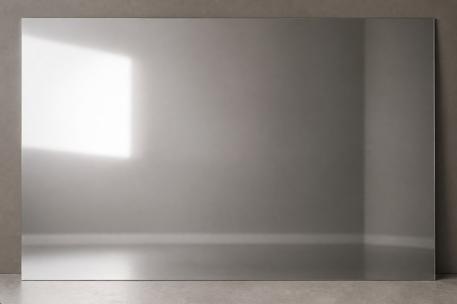 Mirror-polished stainless steel surface reflecting the surrounding studio